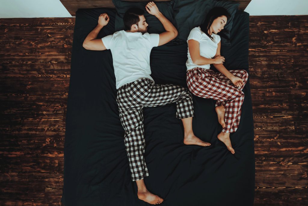 Couple sleeping in strange positions, because it is difficult to find best mattress for couples
